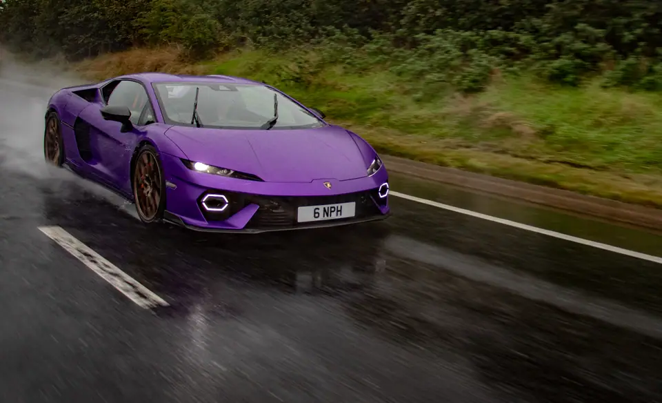 Purple Lamborghini Temerario through the spray on a wet road at Run 4 Eoin 2026