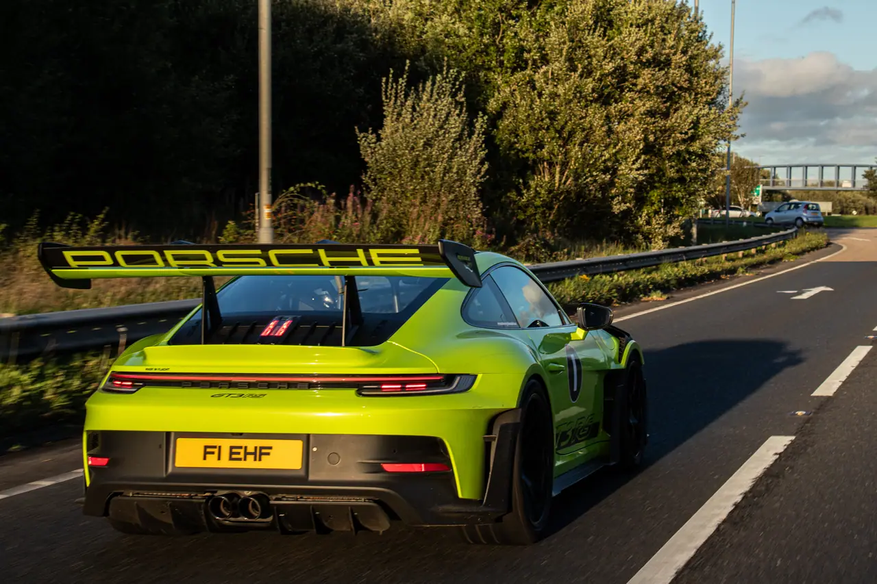 Lime green Porsche 911 GT3 RS on the road in evening light at Run 4 Eoin 2026